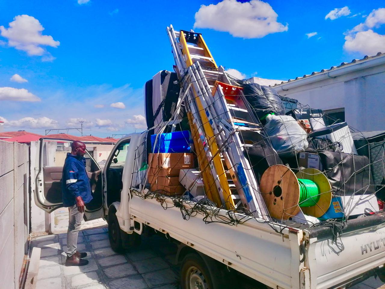 Pereginus crew securing a fully packed removals bakkie