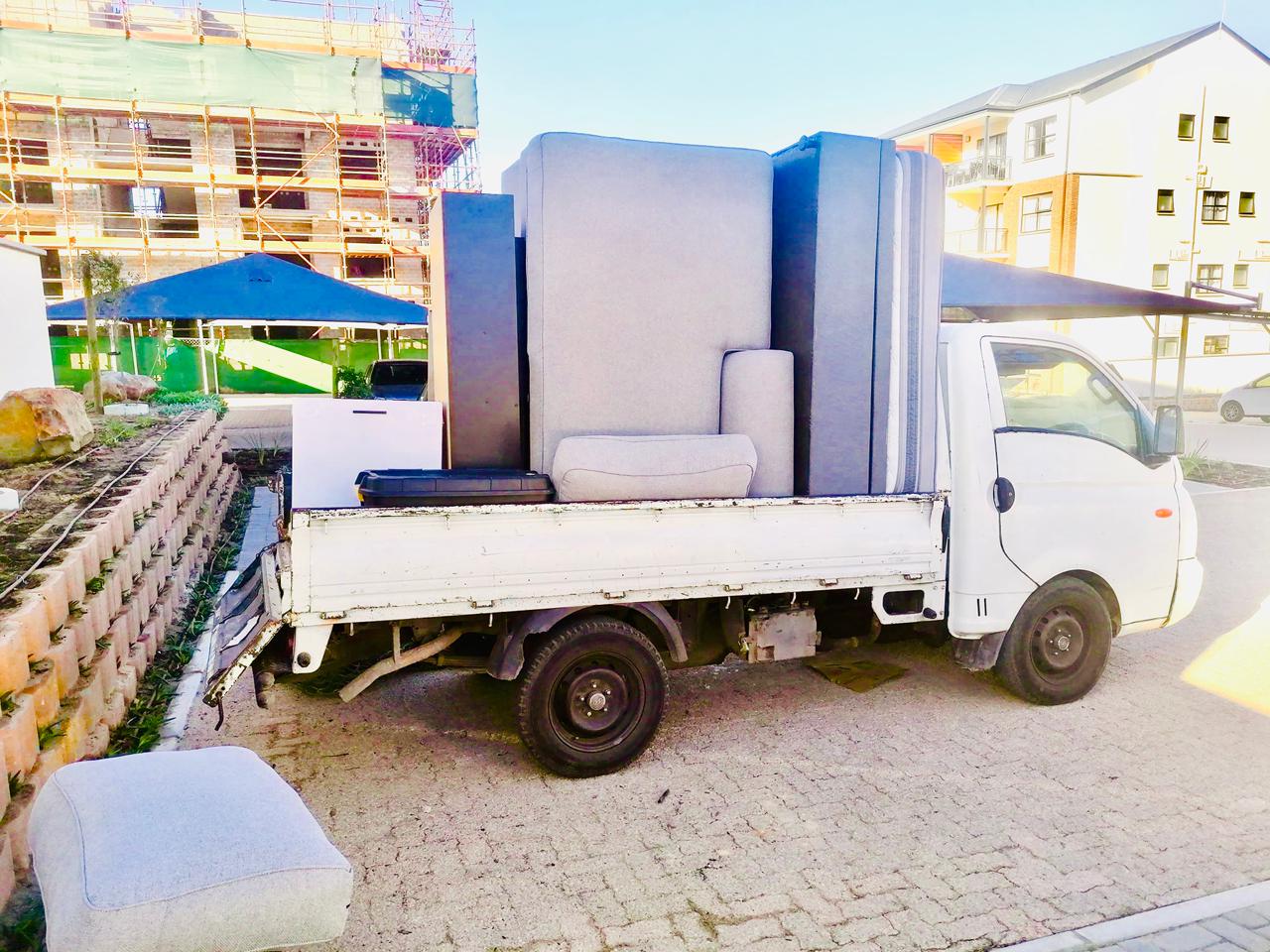 Bakkie loaded with couches and mattresses for a residential move